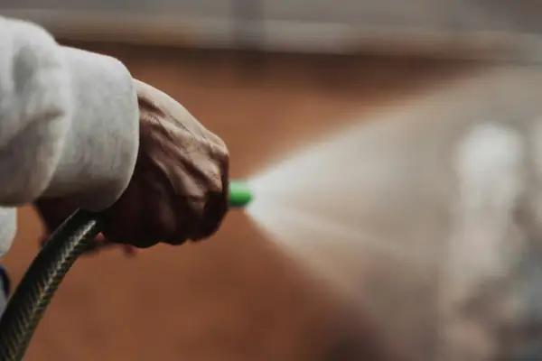 Close-up of a pressure washer nozzle spraying water