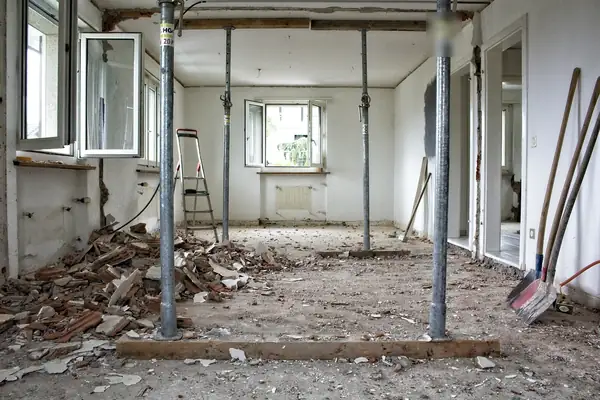 Interior gutted during renovation with temporary support posts